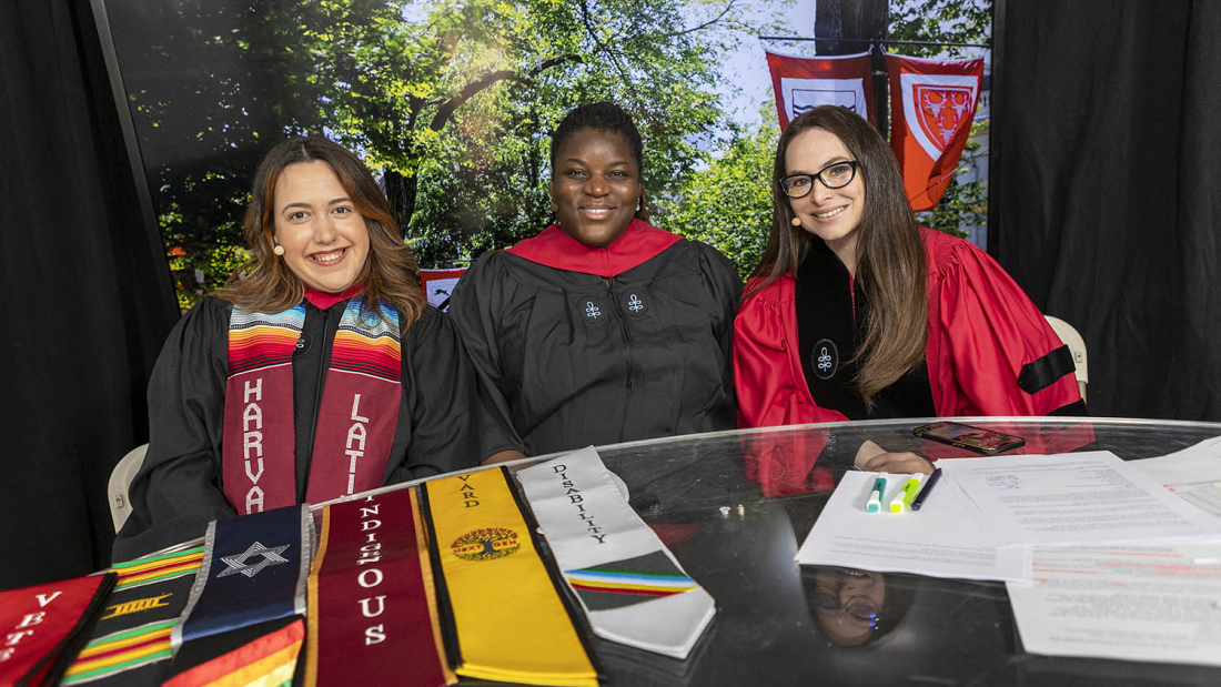 Lecturer Alexis Redding (right) is joined by HGSE alums Anabella Morabito, Ed.M.’22, and Alysha Johnson Williams, Ed.M.’20, to broadcast the Harvard Commencement pre-show