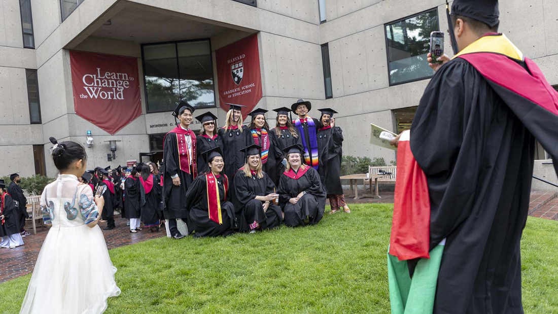 Group of HGSE graduates outside Gutman Commencement 2024